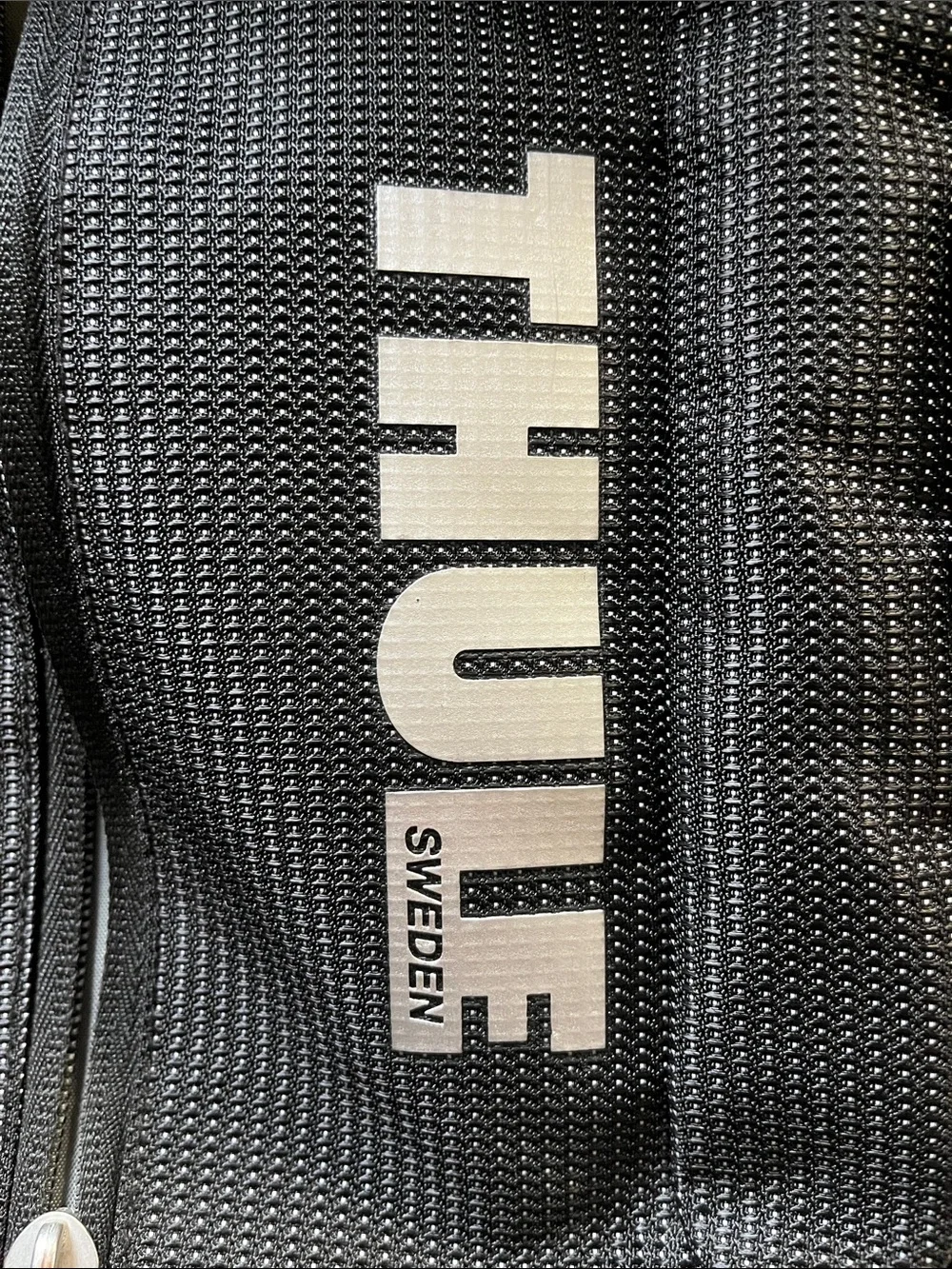 Thule Black Backpack with Teal Zipper Accents